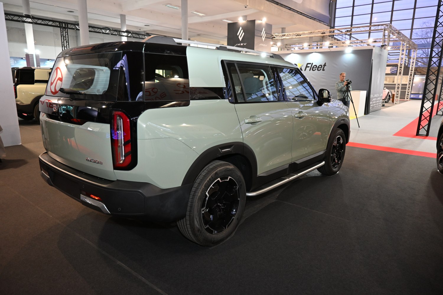 Boxy SUV with vertical rear lights and black wheels