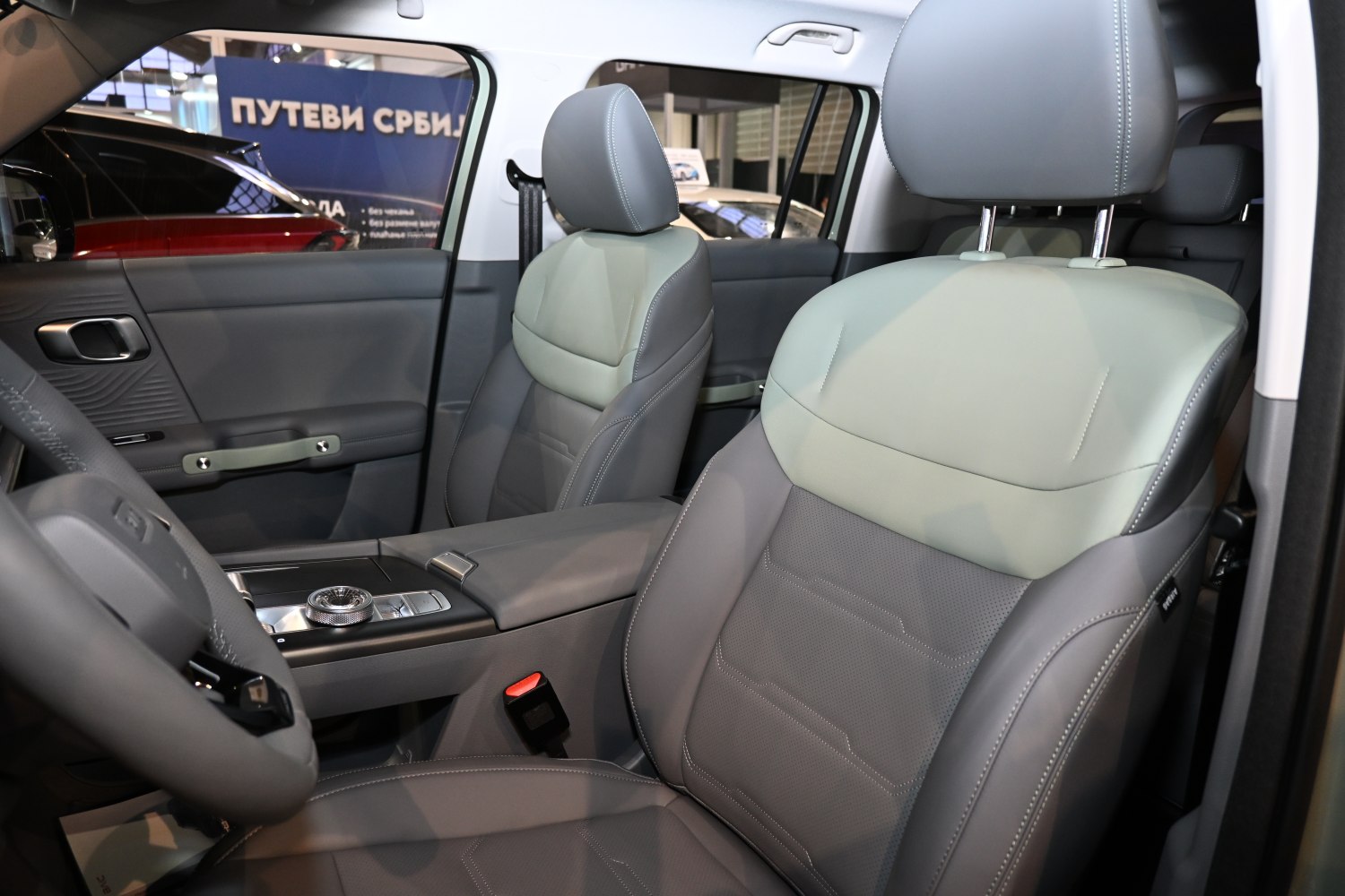Modern car interior with front seats and central control panel