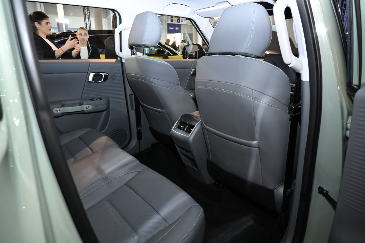 Rear seat interior with grey leather upholstery and rear air vents