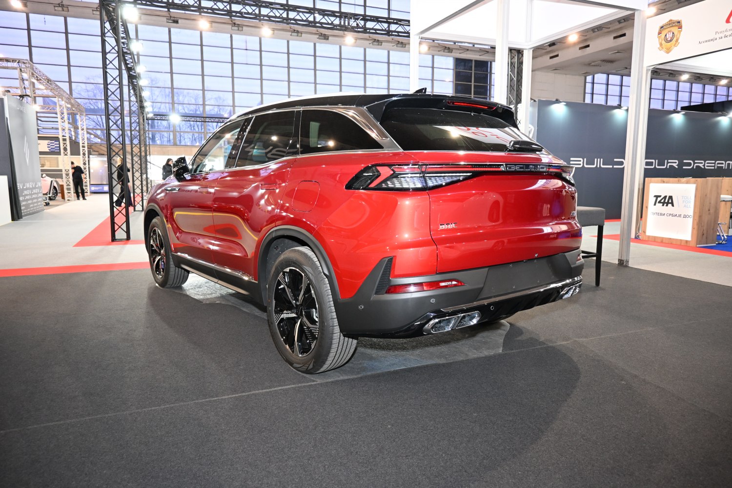 Rear SUV view with LED tail lights and quad exhaust pipes