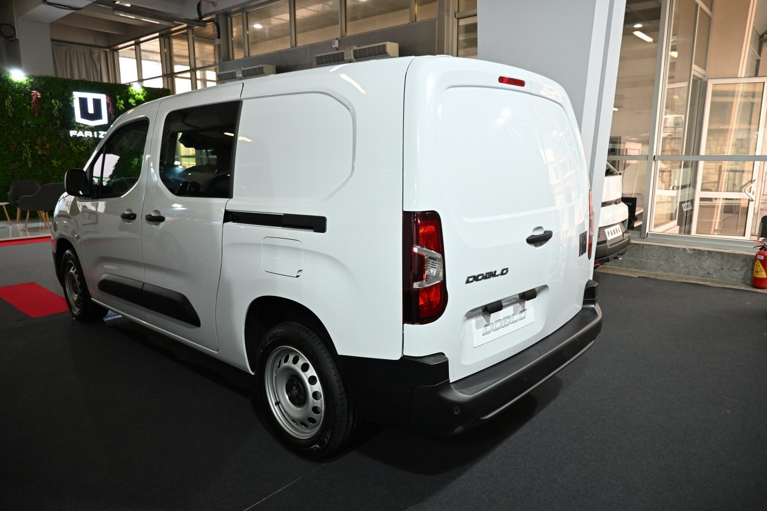 Rear side cargo van with sliding door and steel wheels