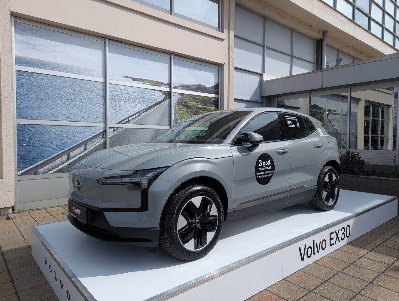 Front-side view of a sleek compact electric SUV with aerodynamic body and modern wheels.