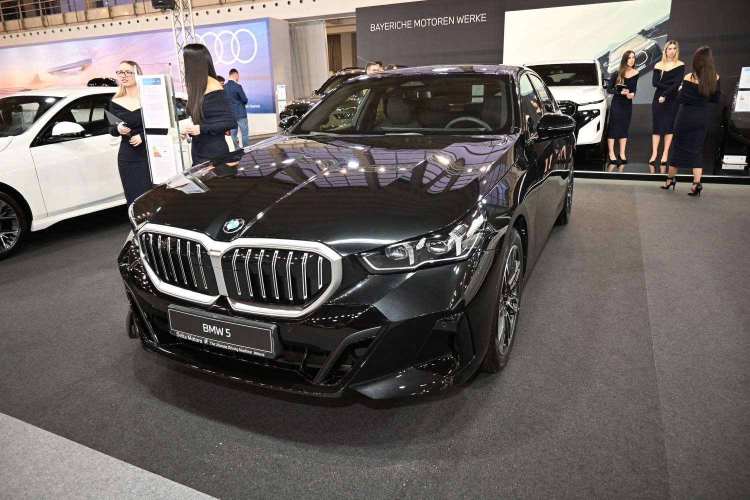 Front view with prominent grille and sleek headlights