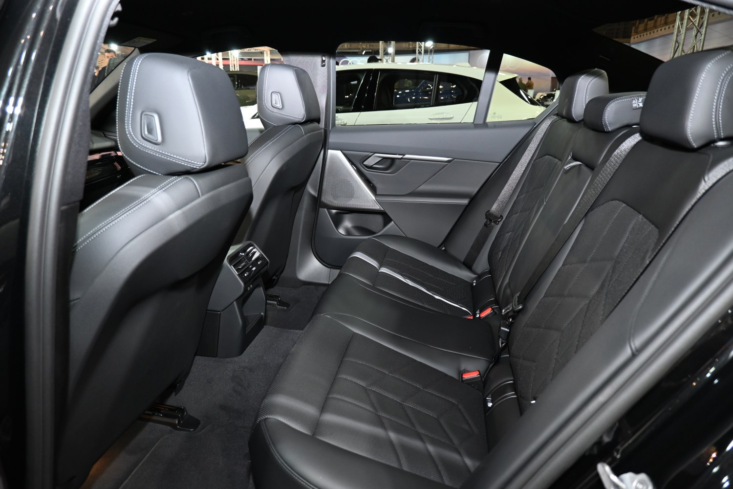 Luxurious black leather rear seats with modern stitching and comfort features