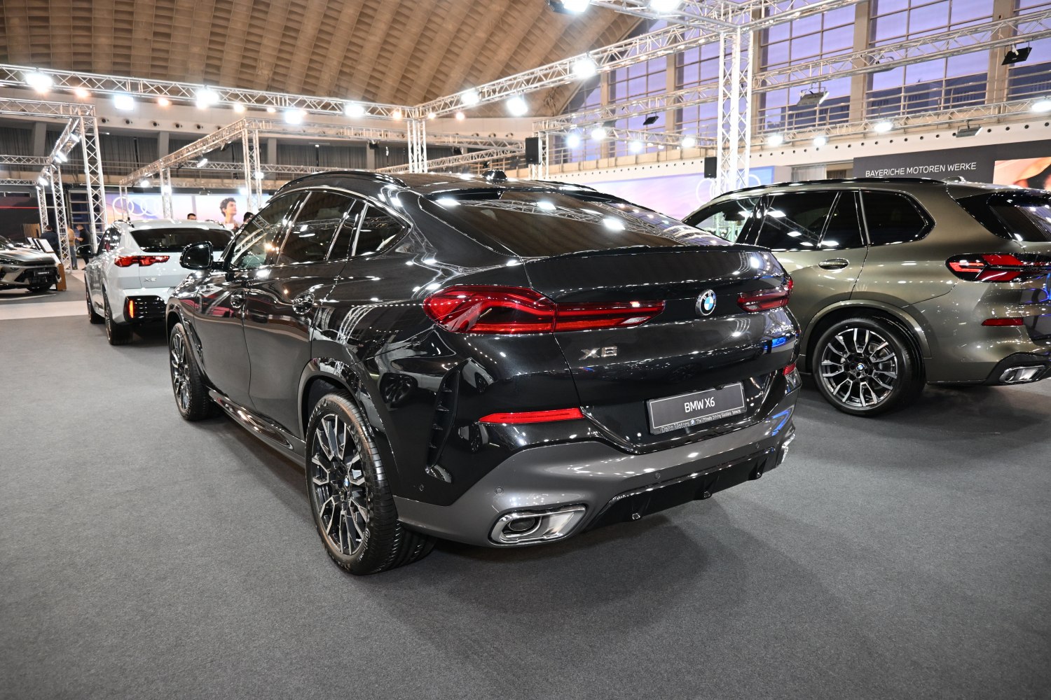 Rear and side view of a black modern luxury SUV with LED tail lights and sporty bumper
