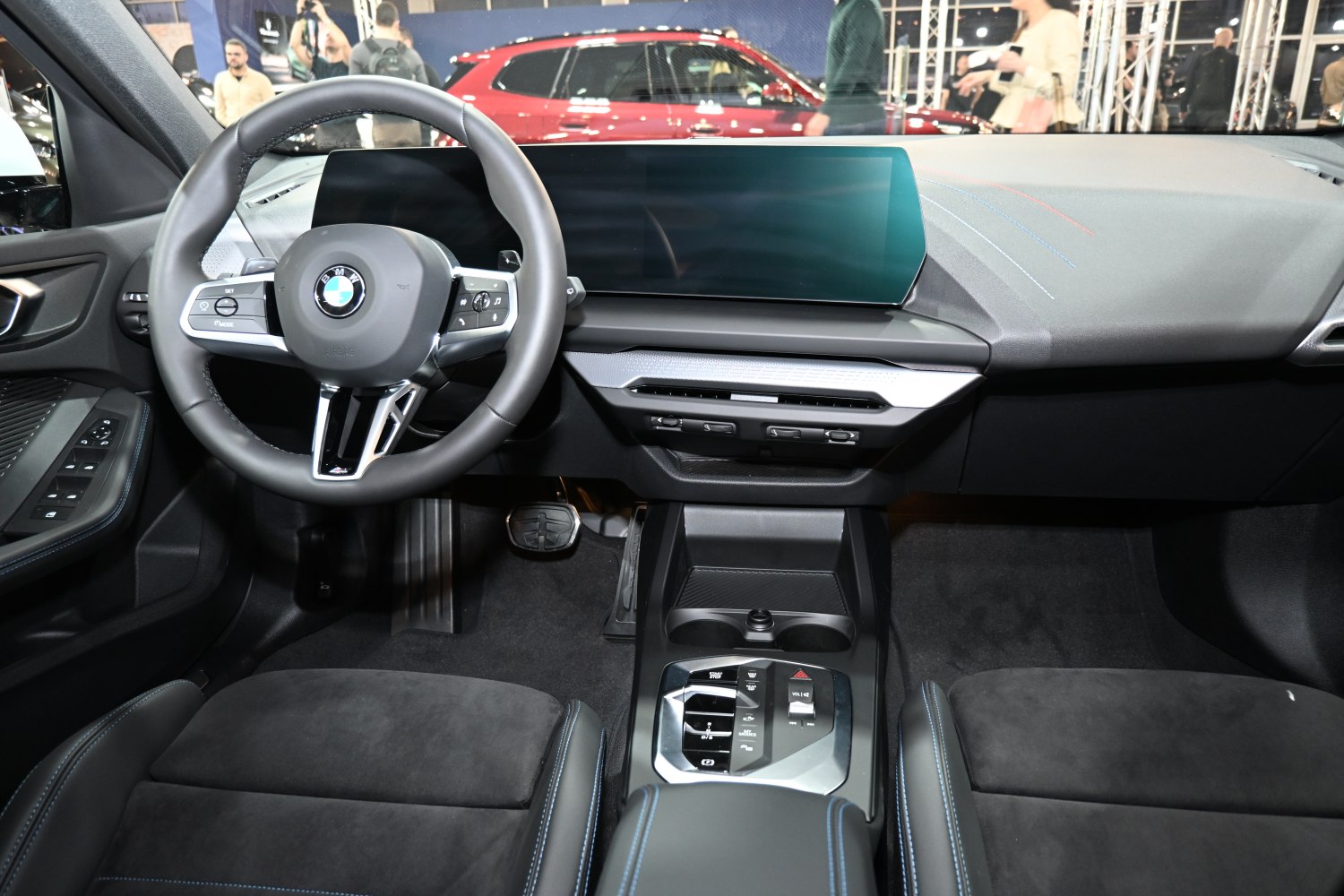 Modern BMW steering wheel and dashboard with digital display