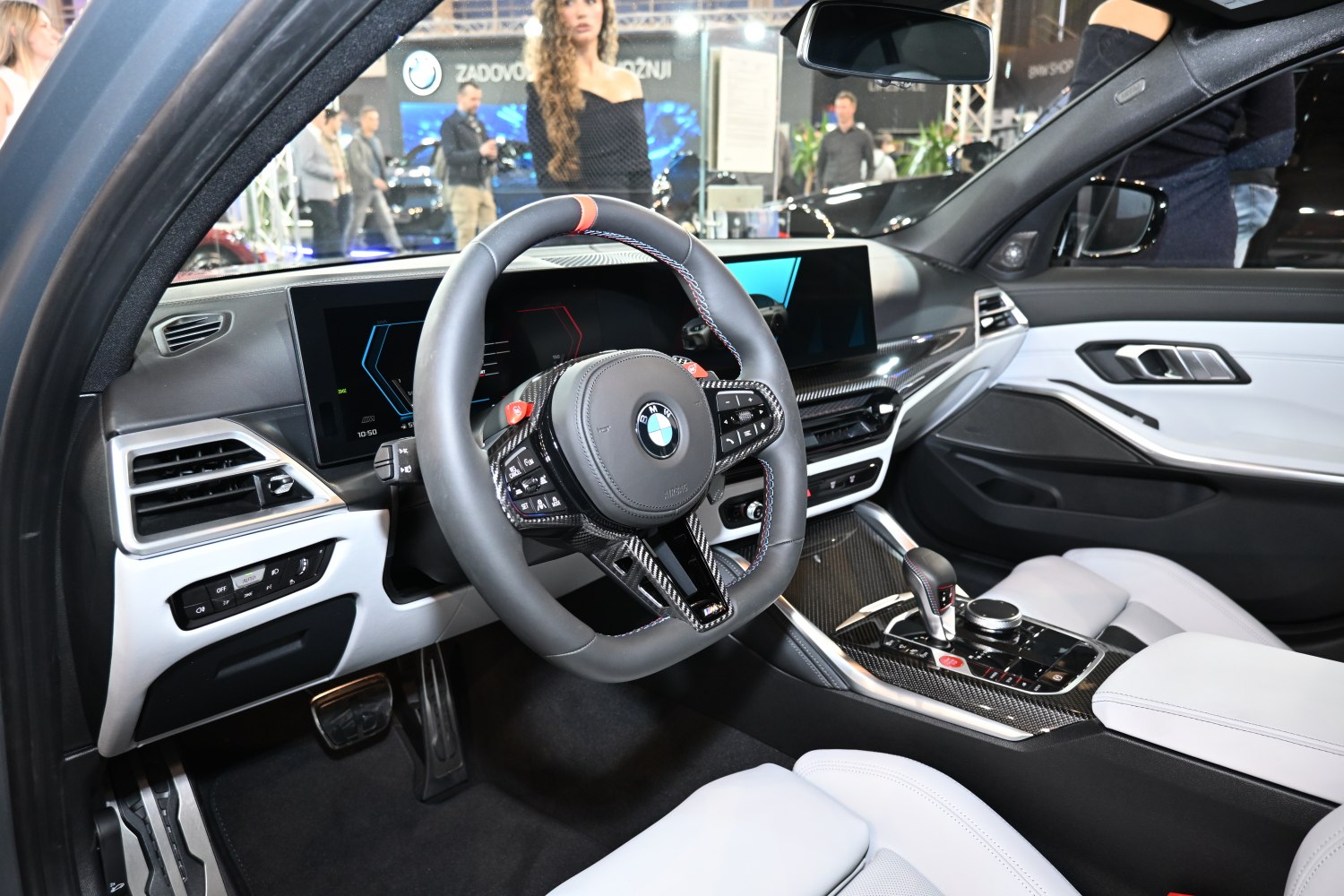 BMW interior with carbon fiber trim and dual digital displays