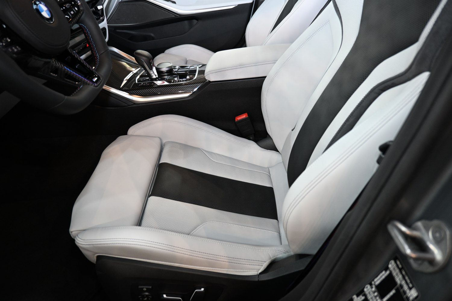 Sport seats with black inserts and carbon fiber center console in BMW interior