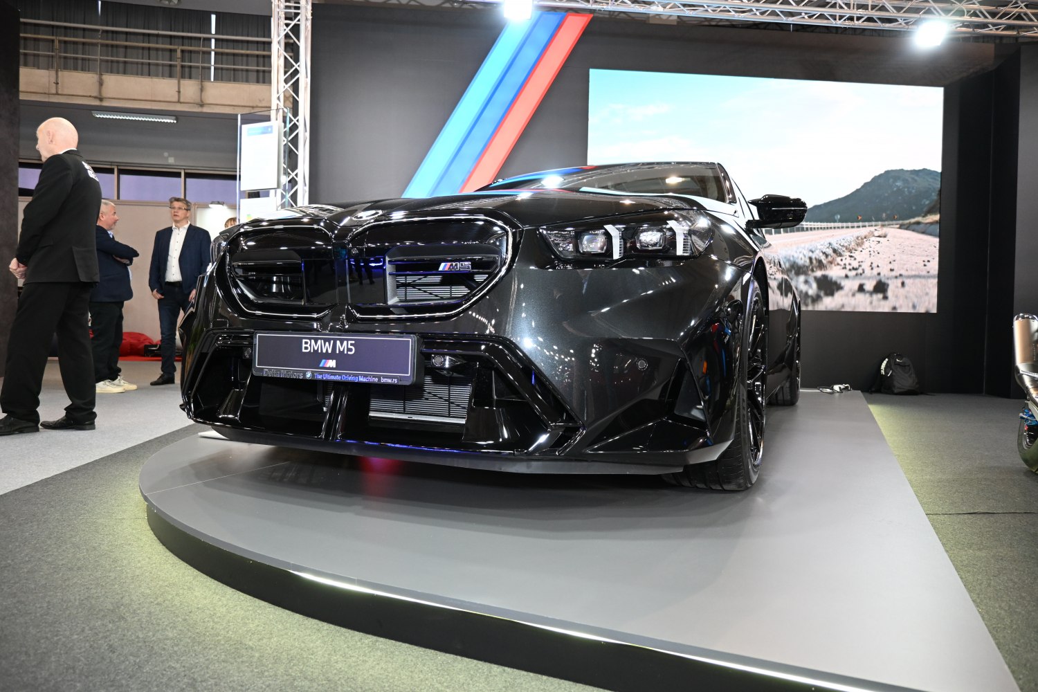 Black car front view with kidney grille and LED headlights