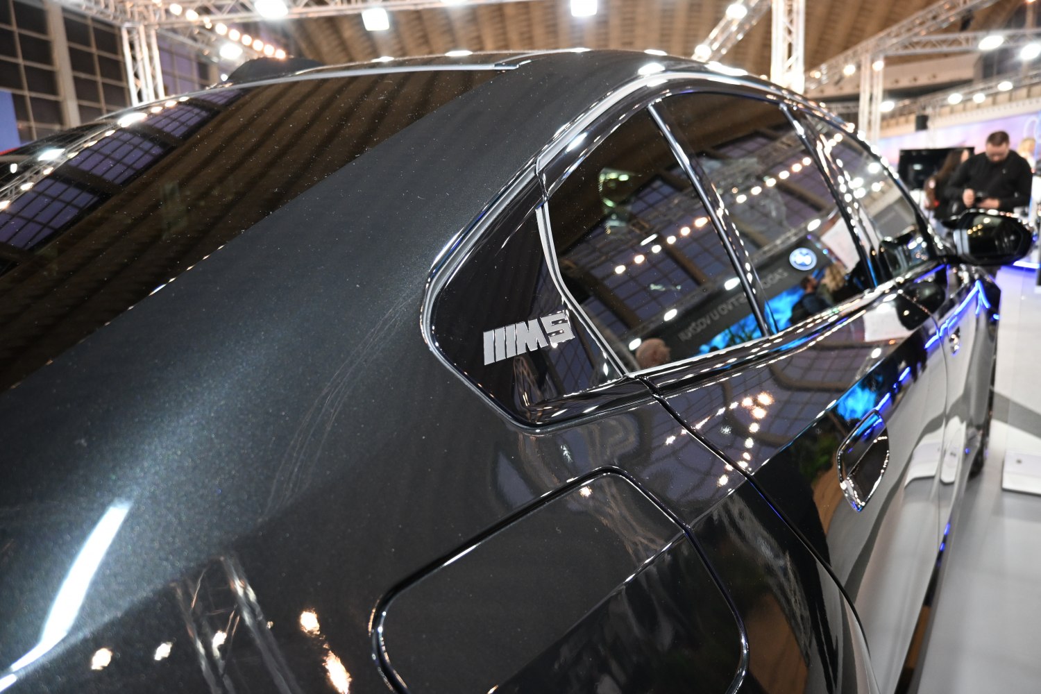 Close-up of side window with M5 badge and fuel door