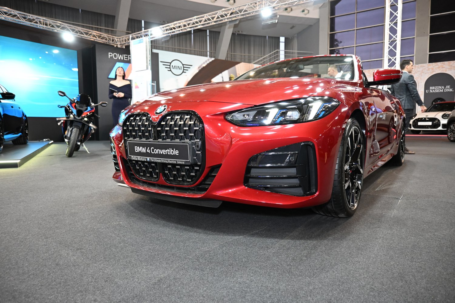 Red convertible front with large grille and LED headlights