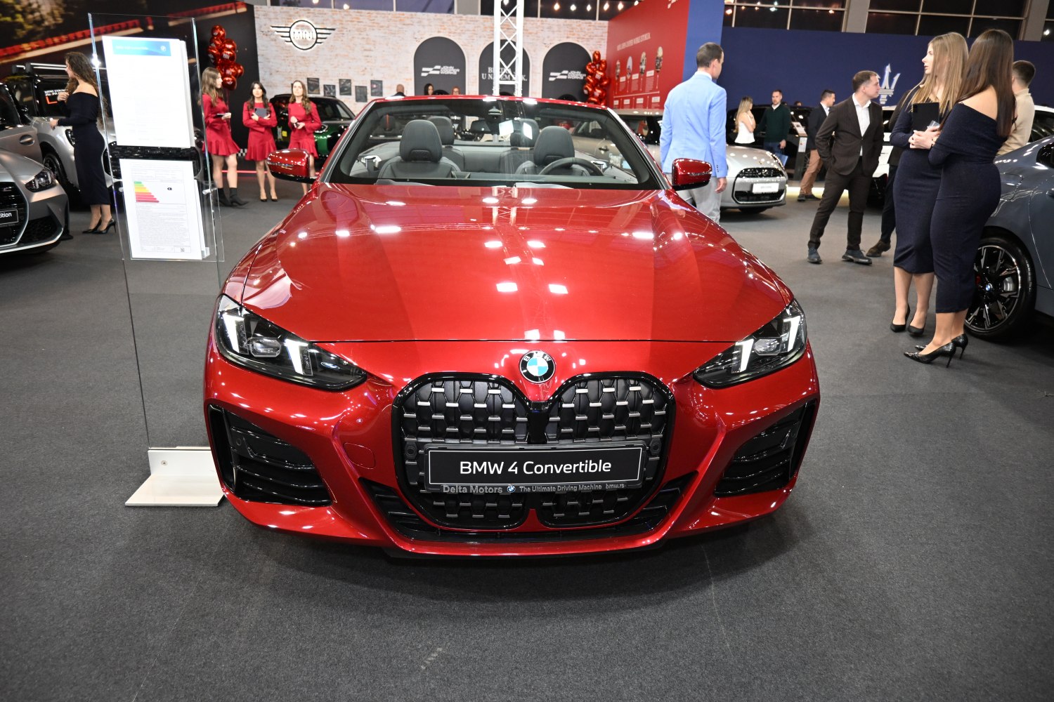Front view of red BMW convertible with large kidney grille and LED headlights