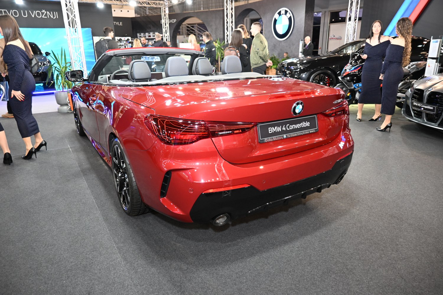 Red convertible rear view with LED taillights and dual exhaust