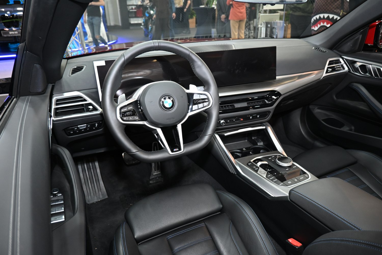 Luxury car interior with digital display and multifunction steering wheel