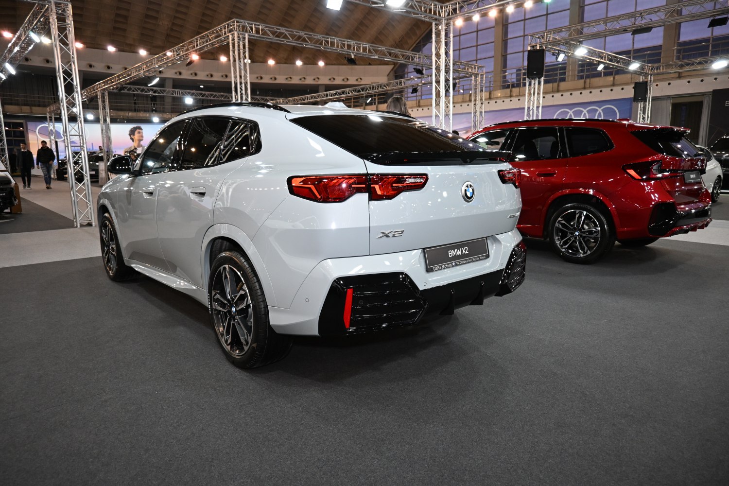 Rear and side view of sporty modern SUV with sleek tail lights and black-accented bumper