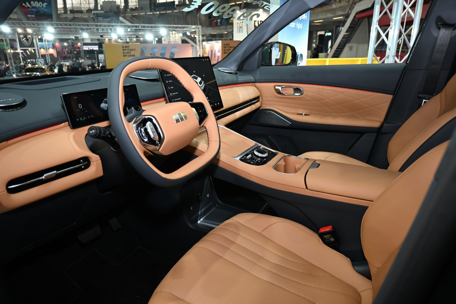 Modern interior with digital dashboard, touchscreen, and tan leather seats