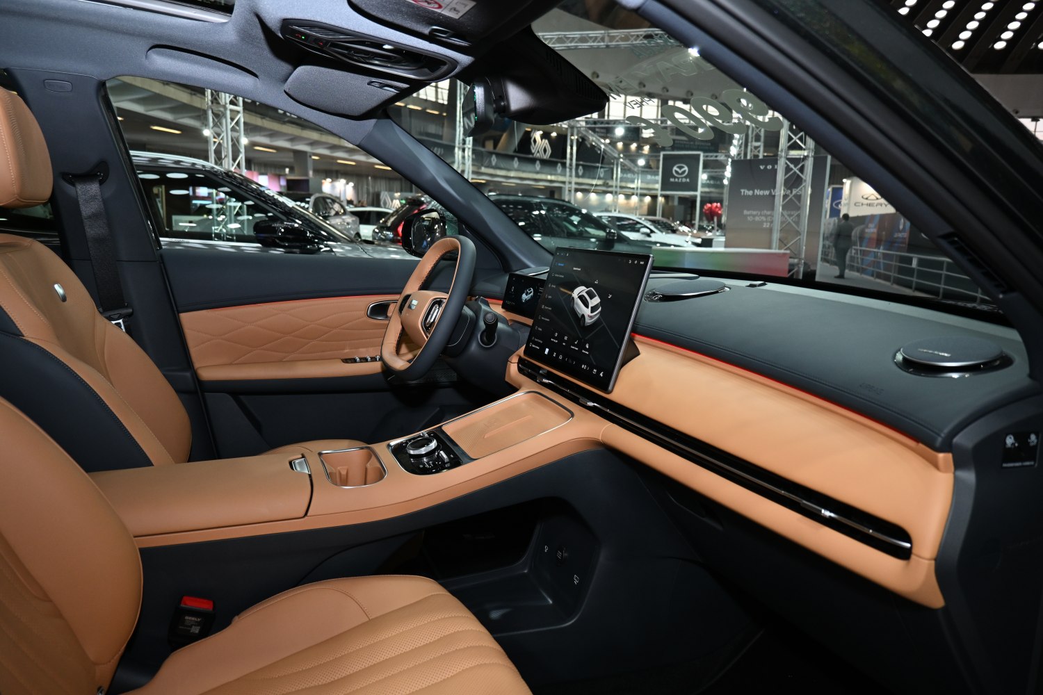 Modern digital touchscreen and luxurious tan leather interior