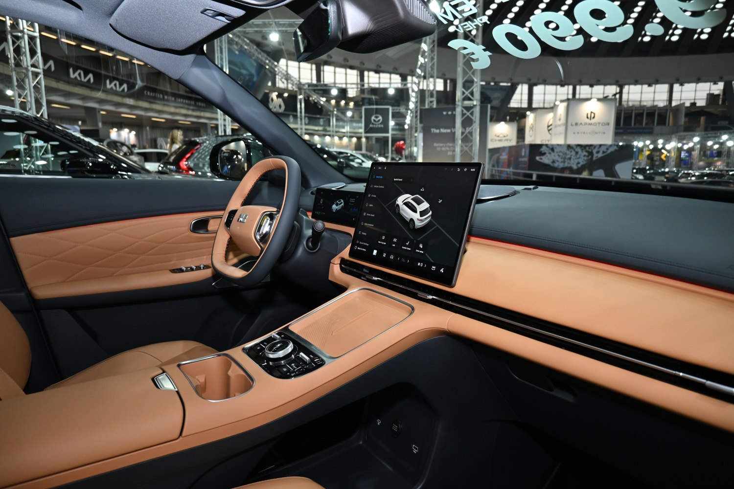 Car interior with digital dashboard, touchscreen, and leather upholstery