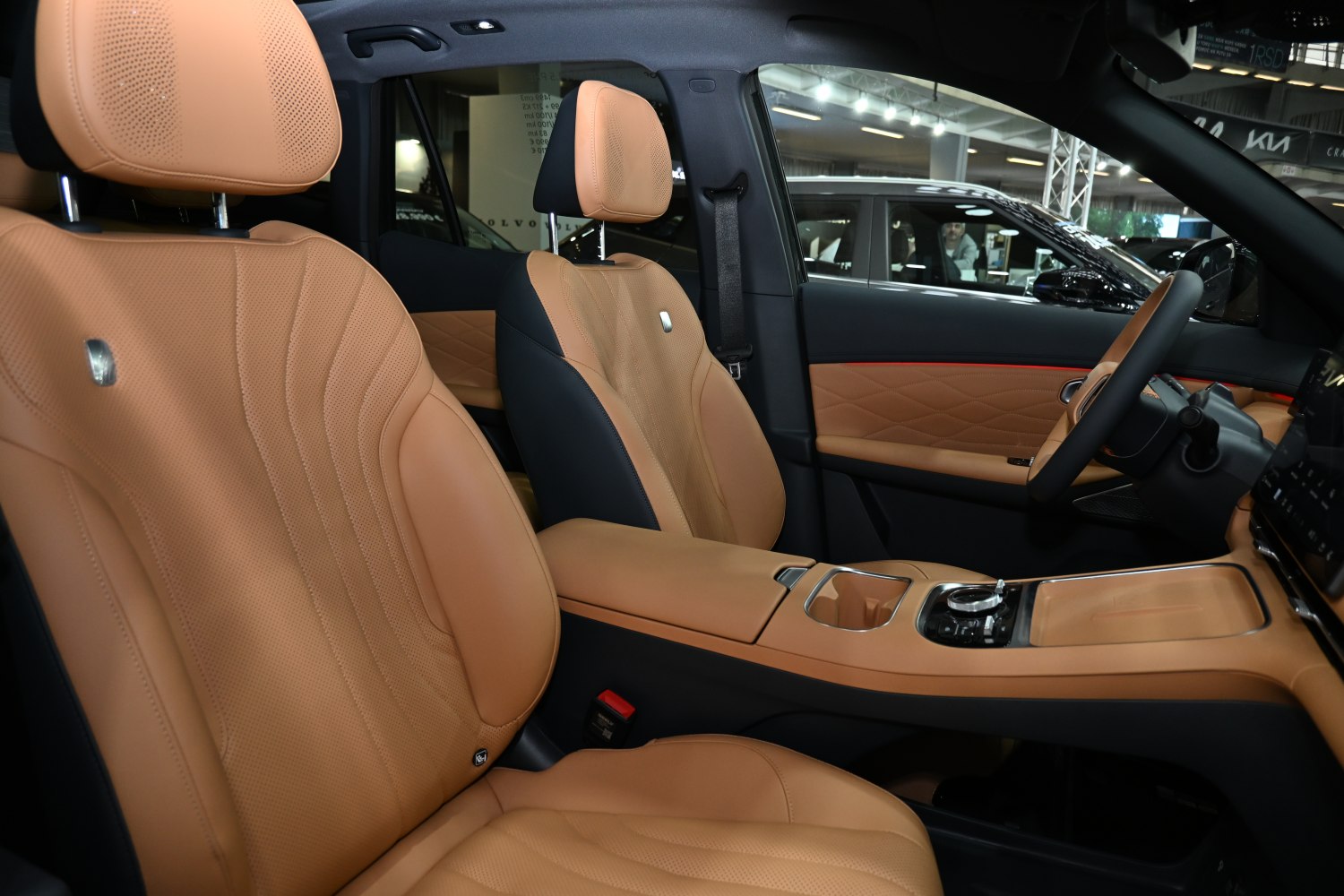 Tan perforated leather seats and modern center console