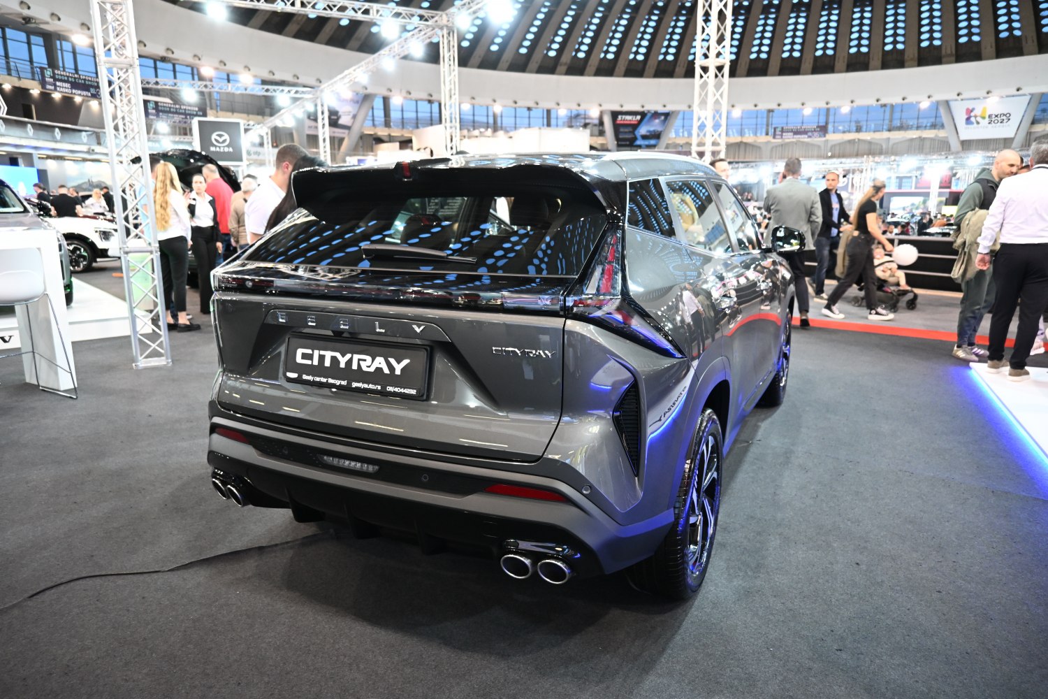Compact SUV rear with sleek taillights and quad exhausts