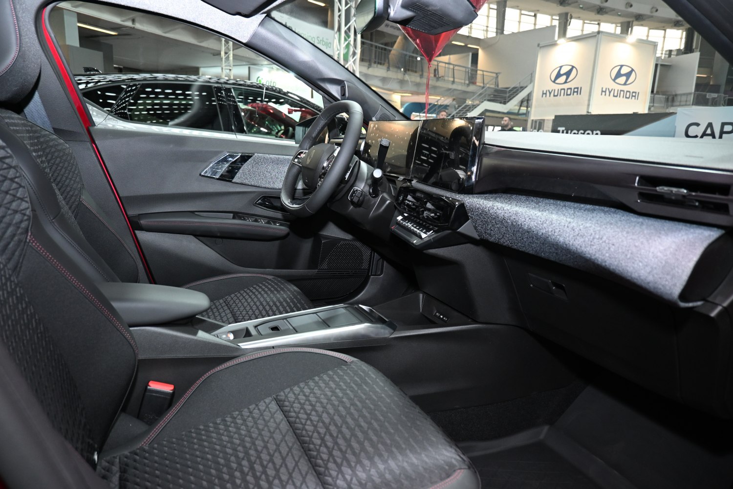 Modern car interior with digital dashboard and quilted seats