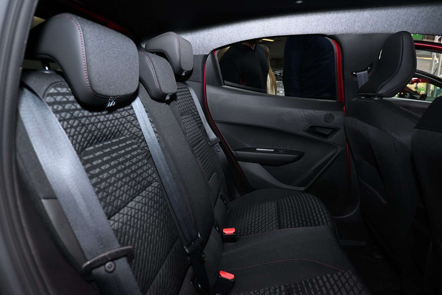 Rear car seat upholstery with headrests and seat belts