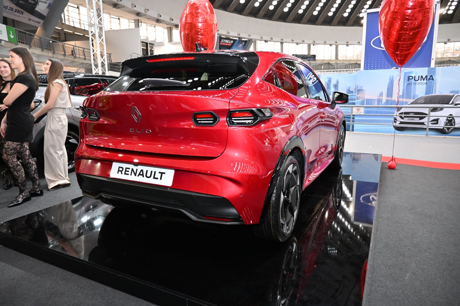 Rear view with distinctive LED taillights and aerodynamic hatchback design