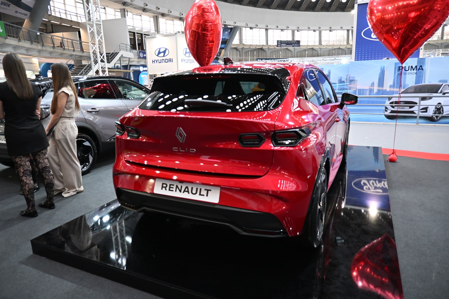 Rear view of red hatchback with sleek taillights and modern styling