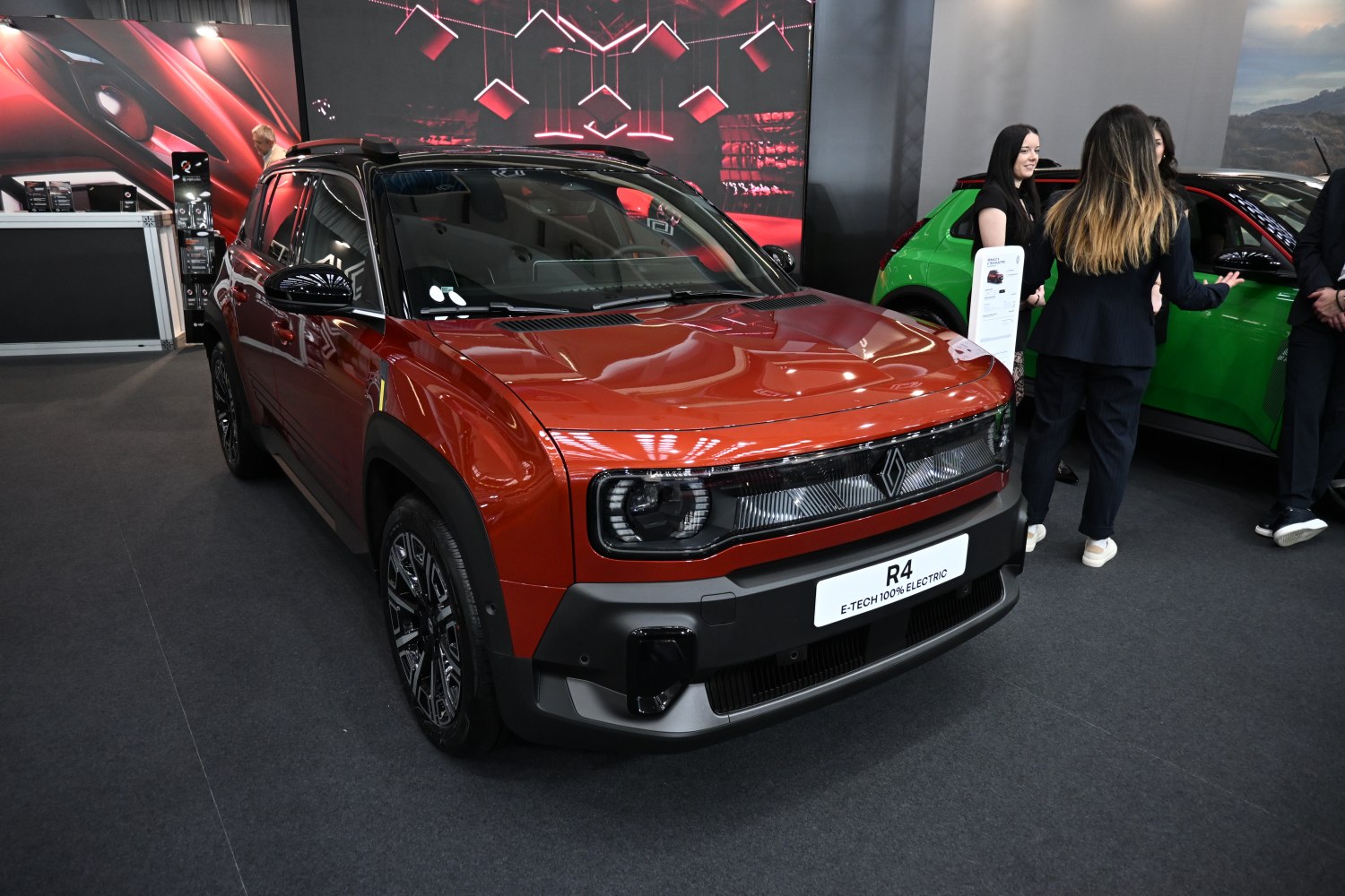 Front view of a modern electric crossover with distinctive lighting.