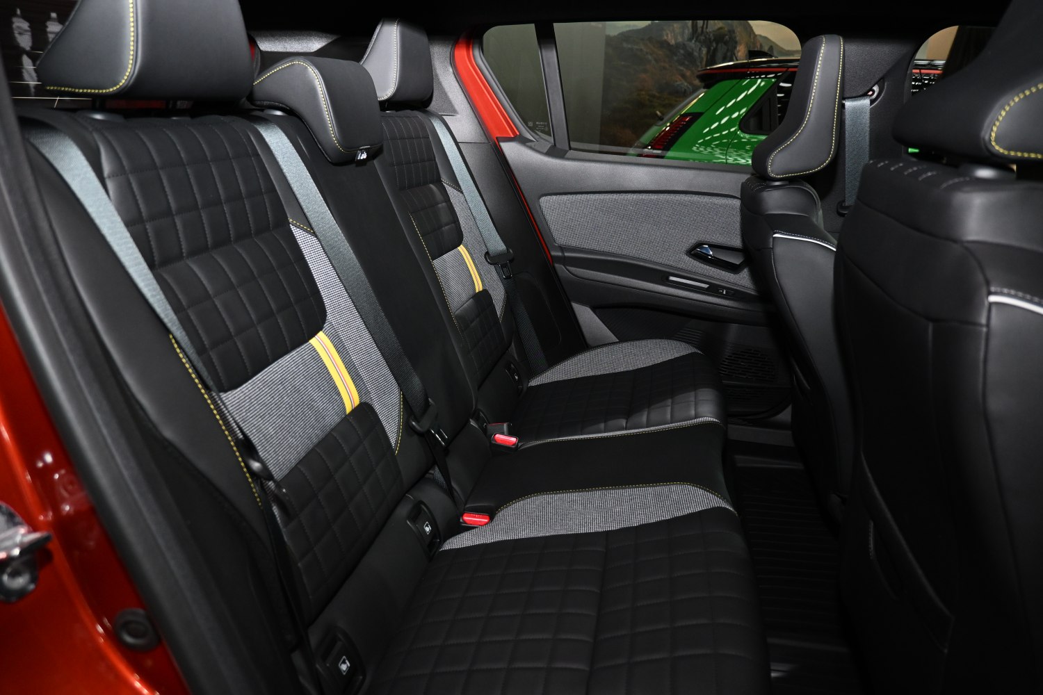 Quilted rear seats with contrast stitching and fabric inserts
