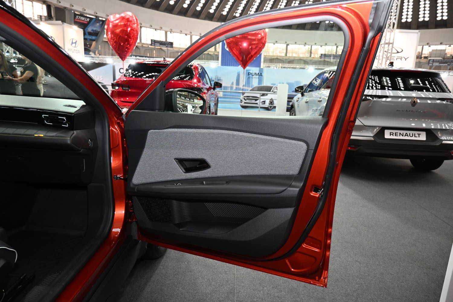 Front door interior panel with fabric, handle, and controls