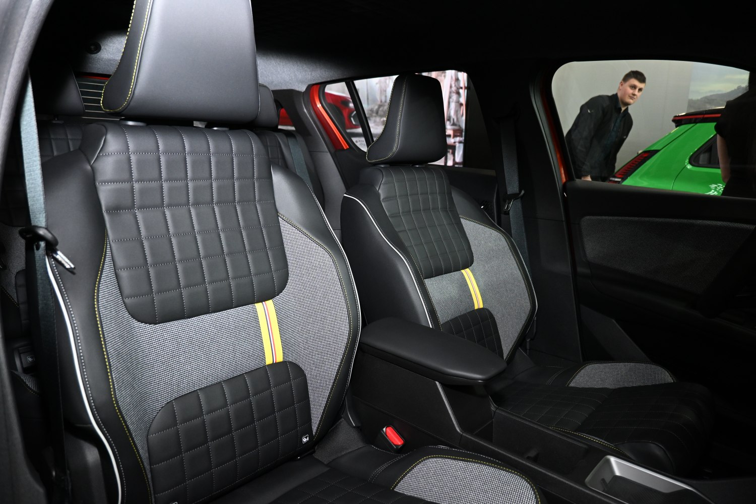 Quilted leather and fabric front seats with yellow accent stitching