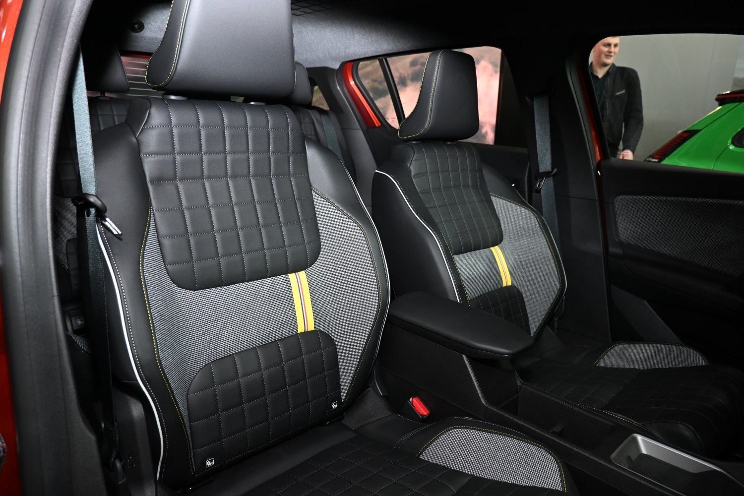 Quilted leather and fabric front seats with yellow striped accent
