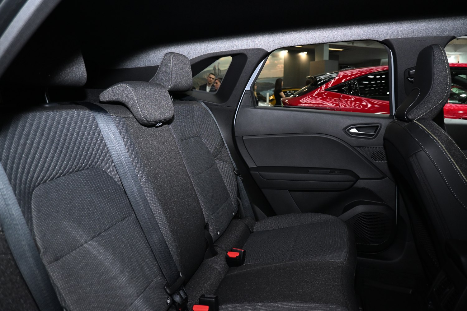 Detailed rear seat upholstery and door panel in car interior