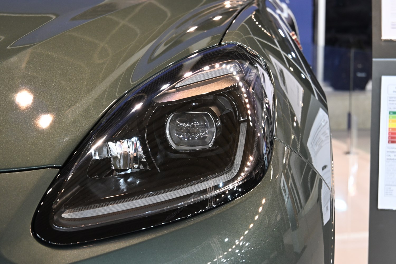 Close-up of modern LED headlight with sleek design and reflective surface