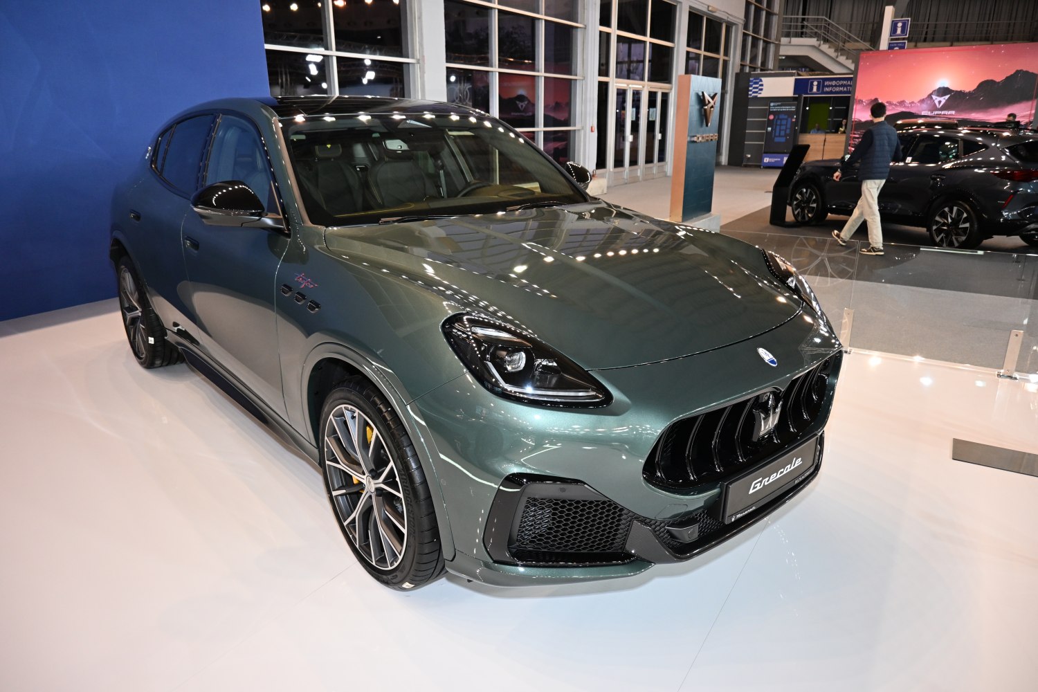 Front view of an SUV with prominent grille and alloy wheels