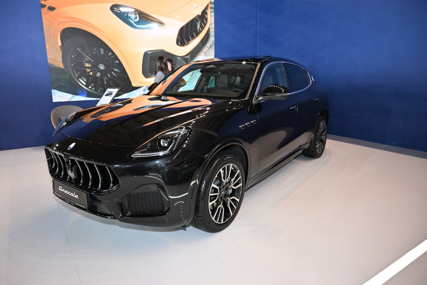 Luxury black SUV front grille and alloy wheels with sleek headlights