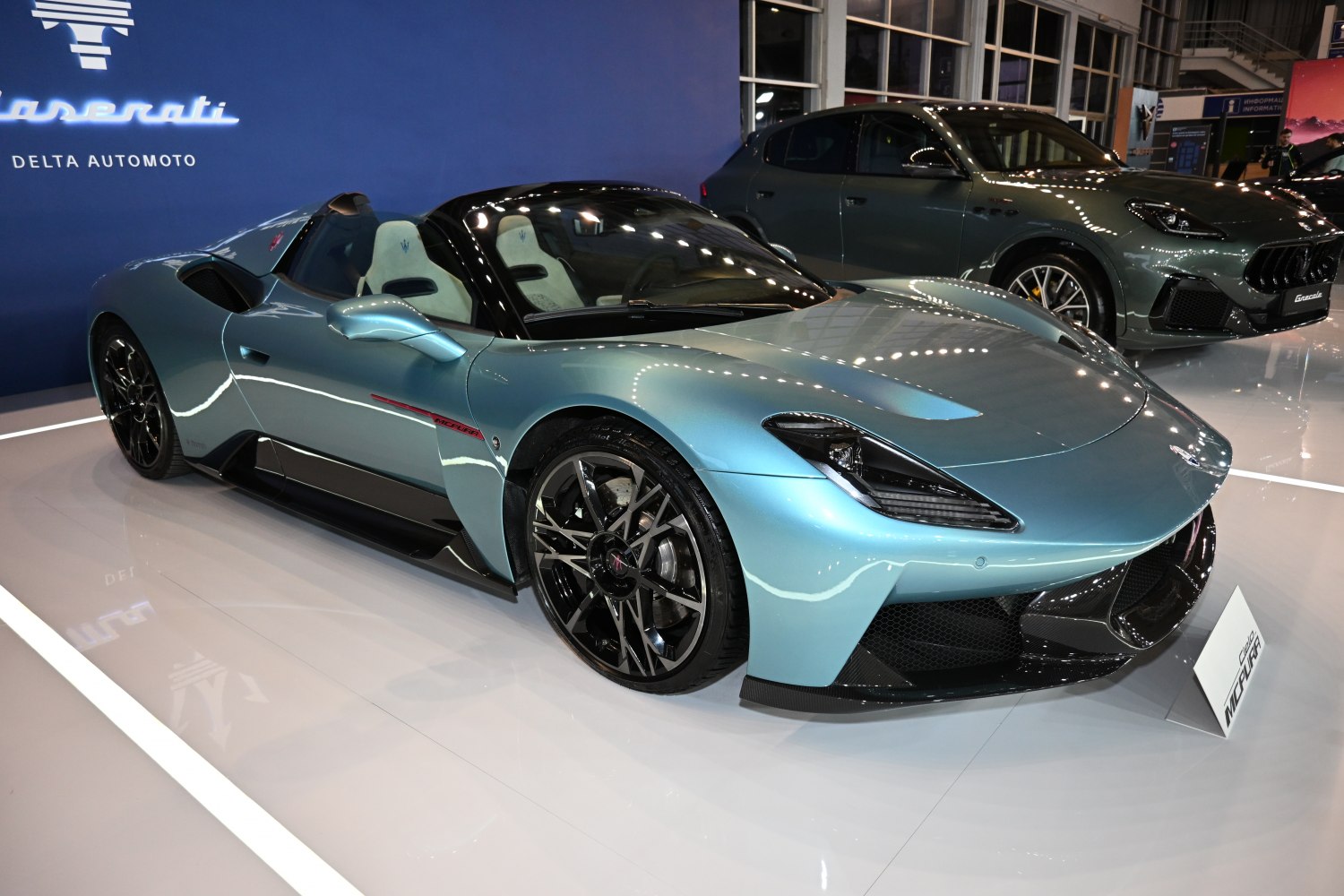Low-profile aerodynamic roadster with modern headlamps and intricate alloy wheels