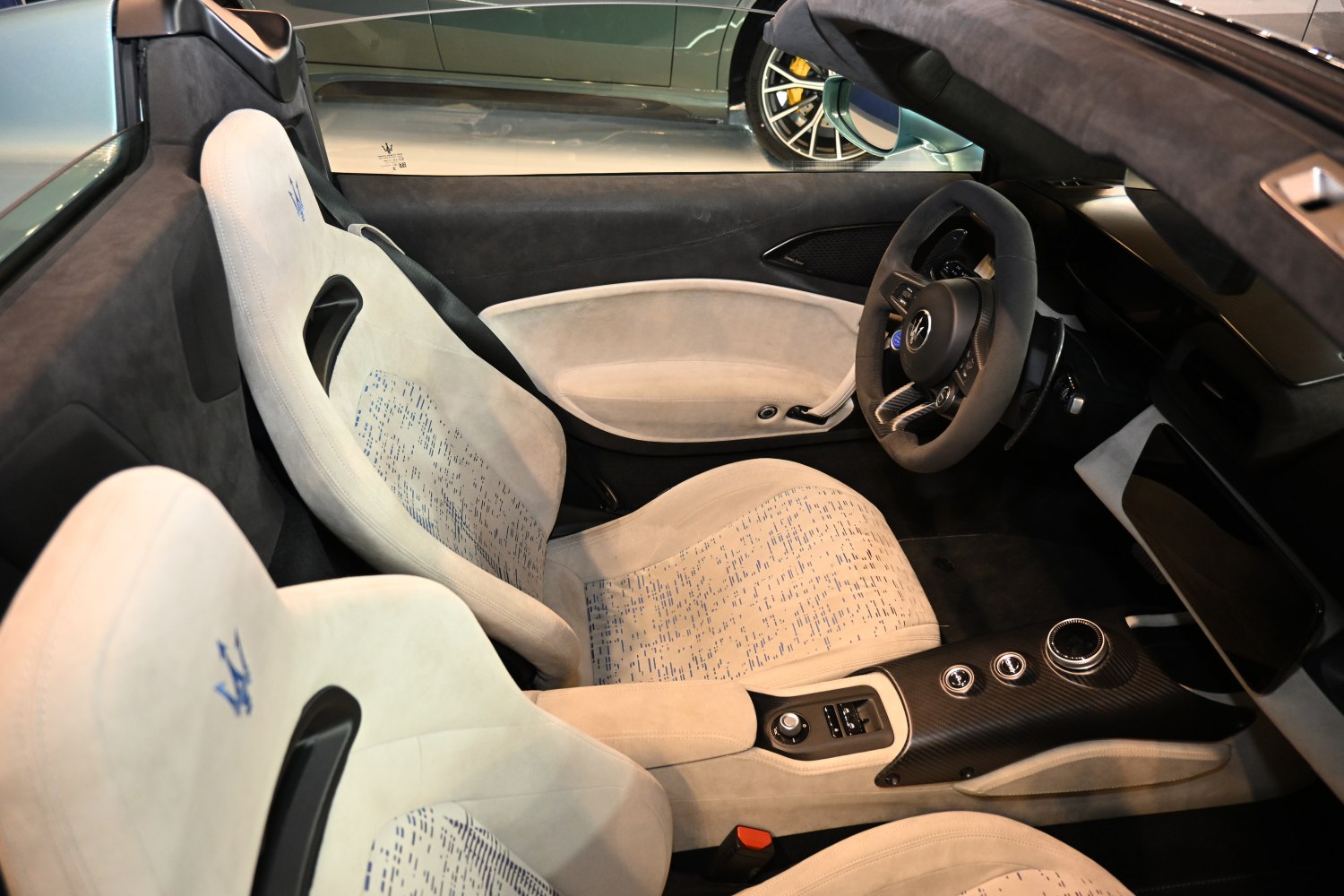 Luxurious sporty seats and carbon fiber center console in a car interior