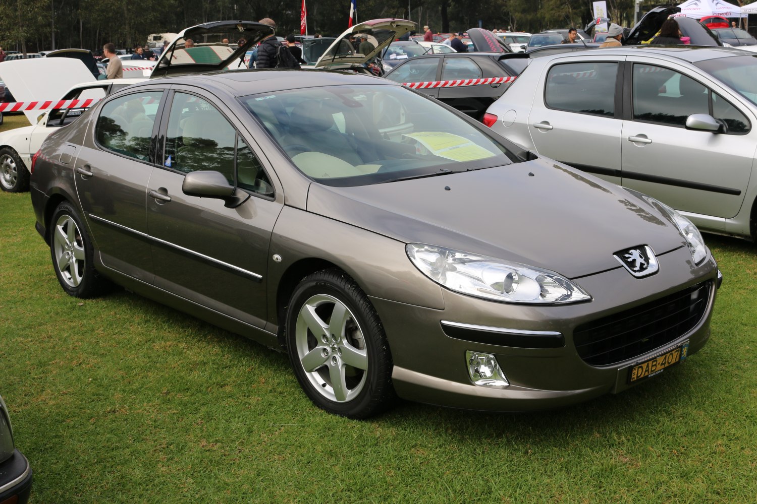Front side view of a mid-size sedan with alloy wheels and metallic paint