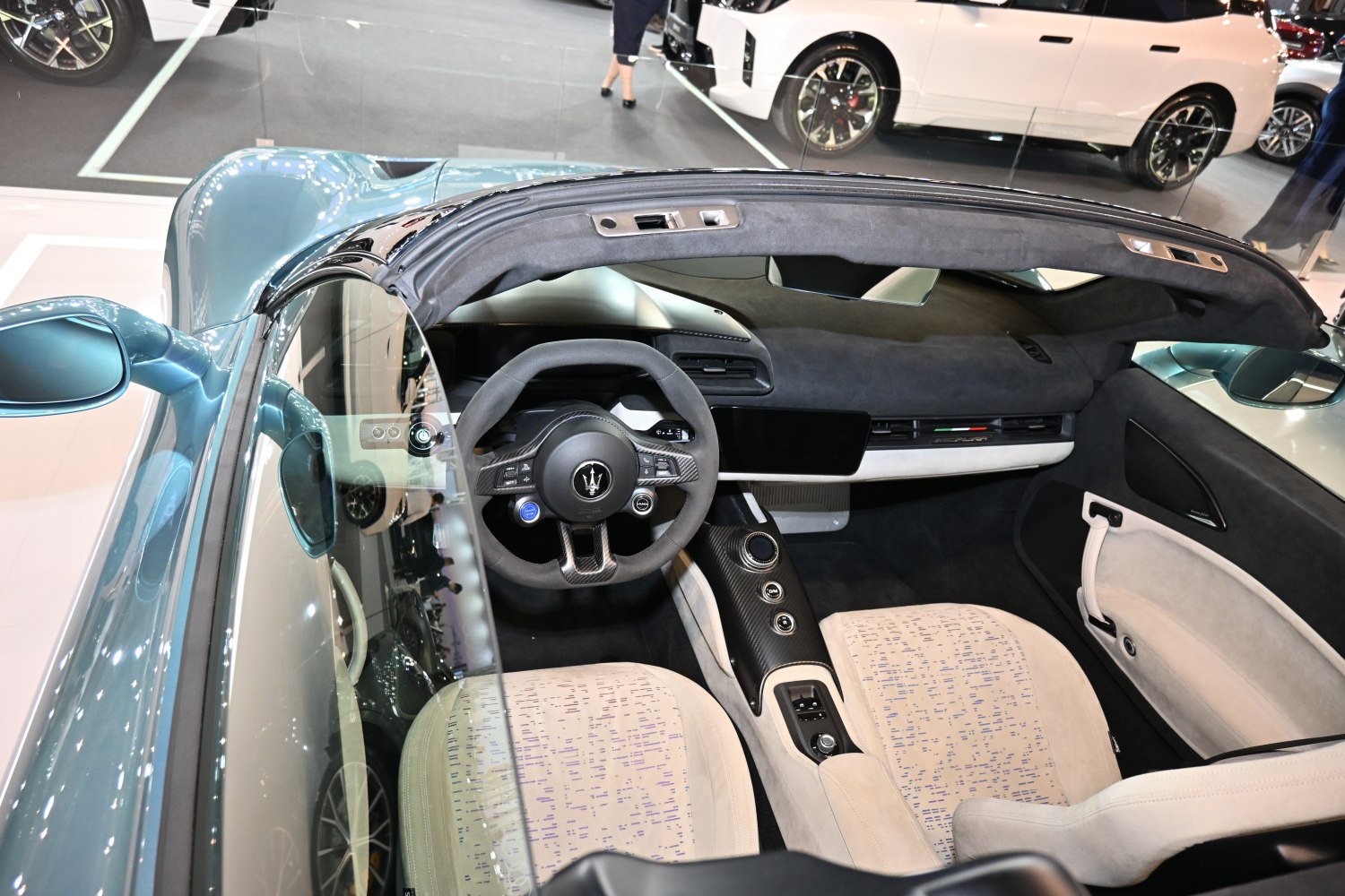Modern luxury interior with digital dashboard and carbon fiber accents