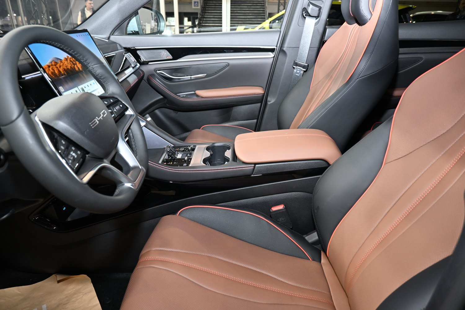 Leather seats and digital dashboard with touchscreen in car interior
