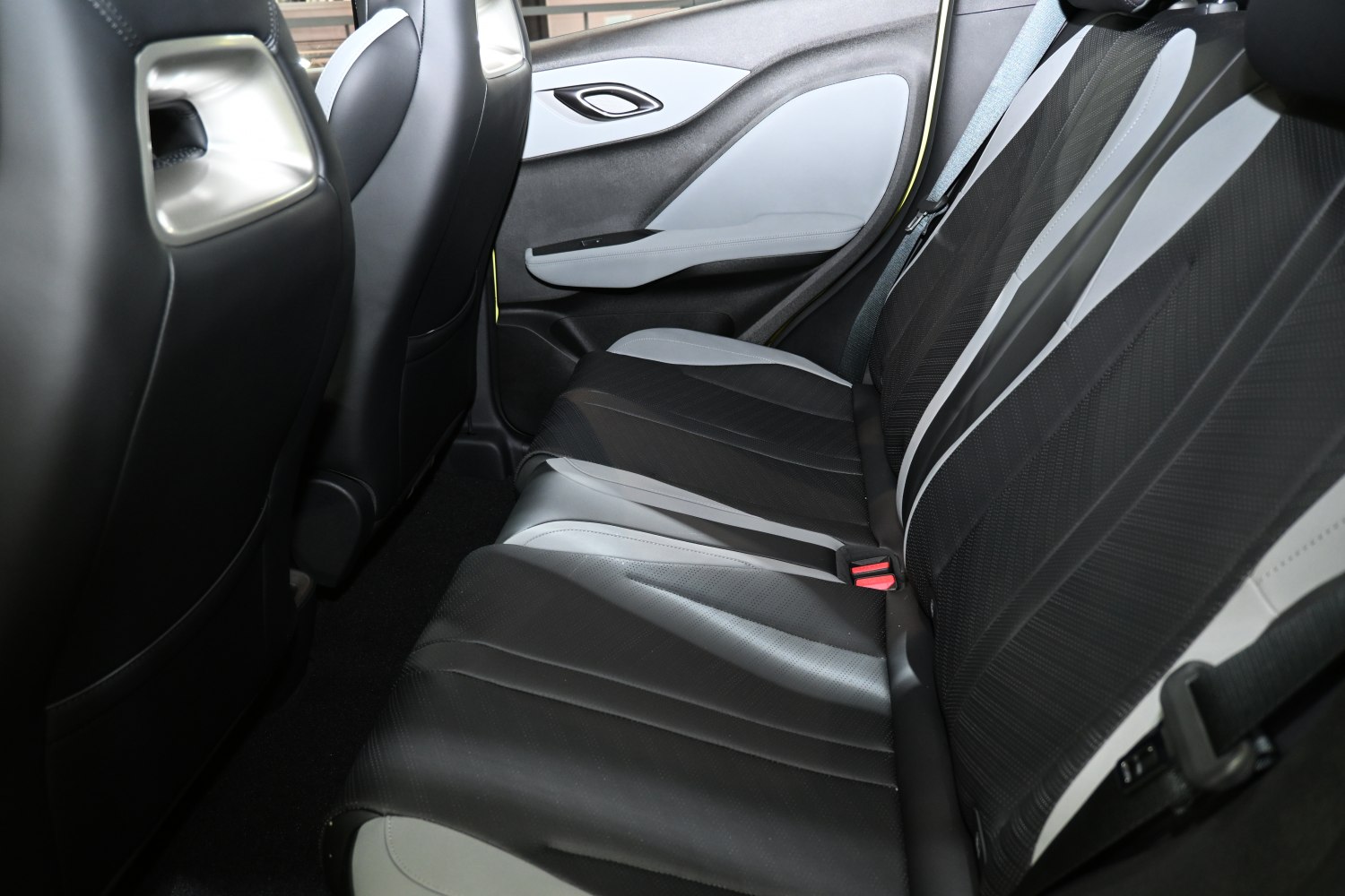 Modern two-tone rear seats with premium upholstery and comfort features