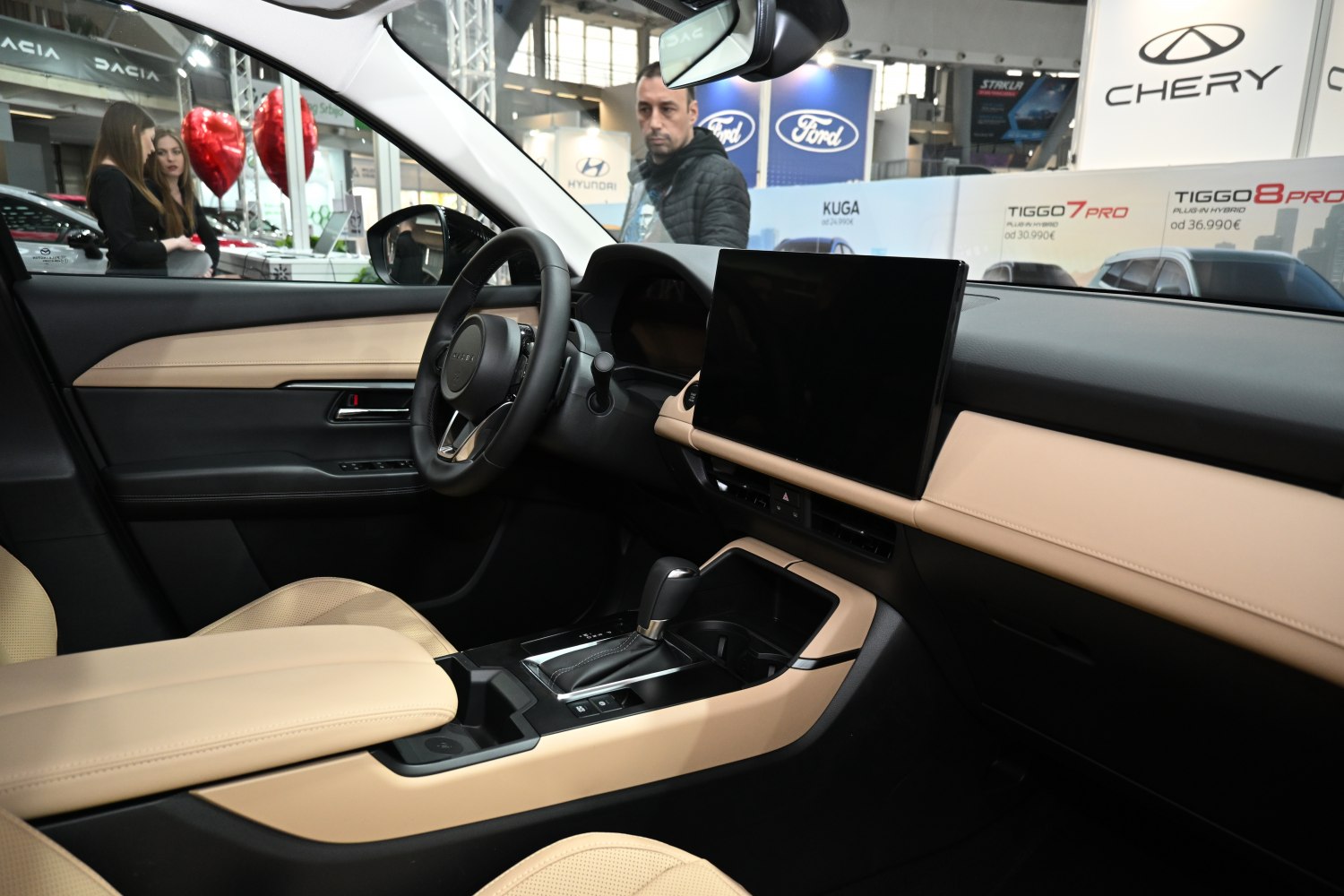 Beige leather seats and large touchscreen dashboard