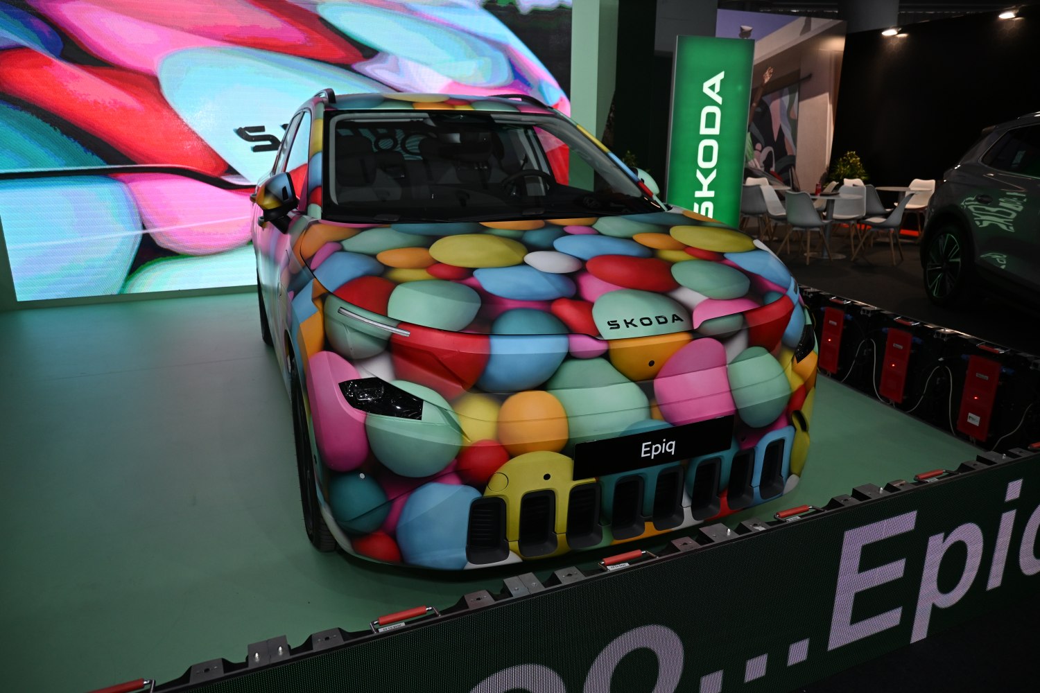 Front view of vehicle with colorful pebble-pattern wrap