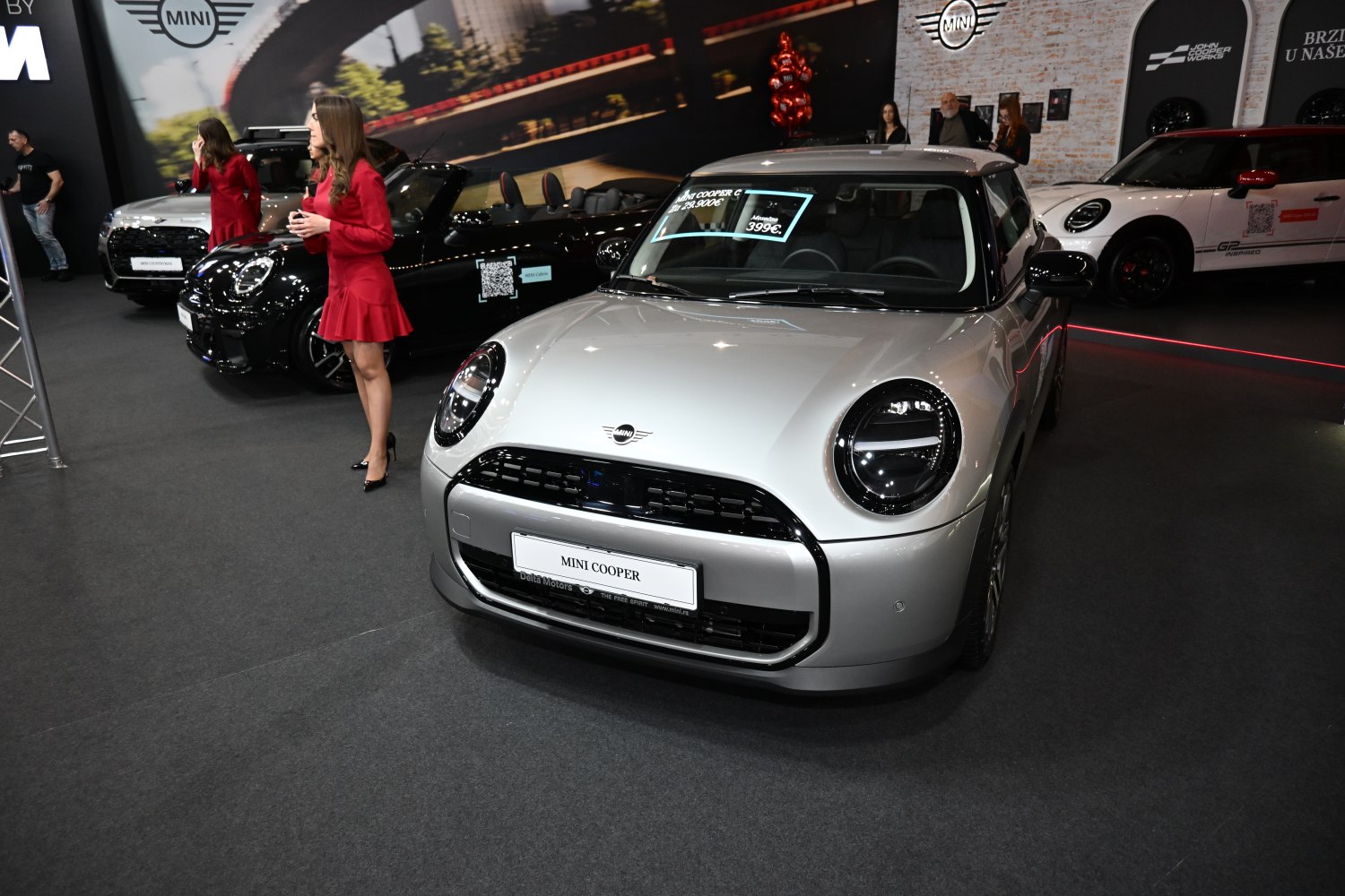 Compact hatchback front view with round headlights and modern design