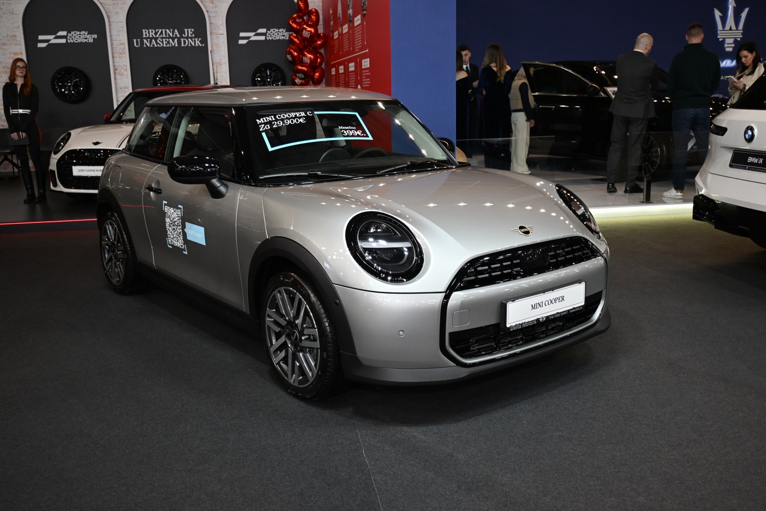 Front 3/4 silver hatch with LED round headlights and grille