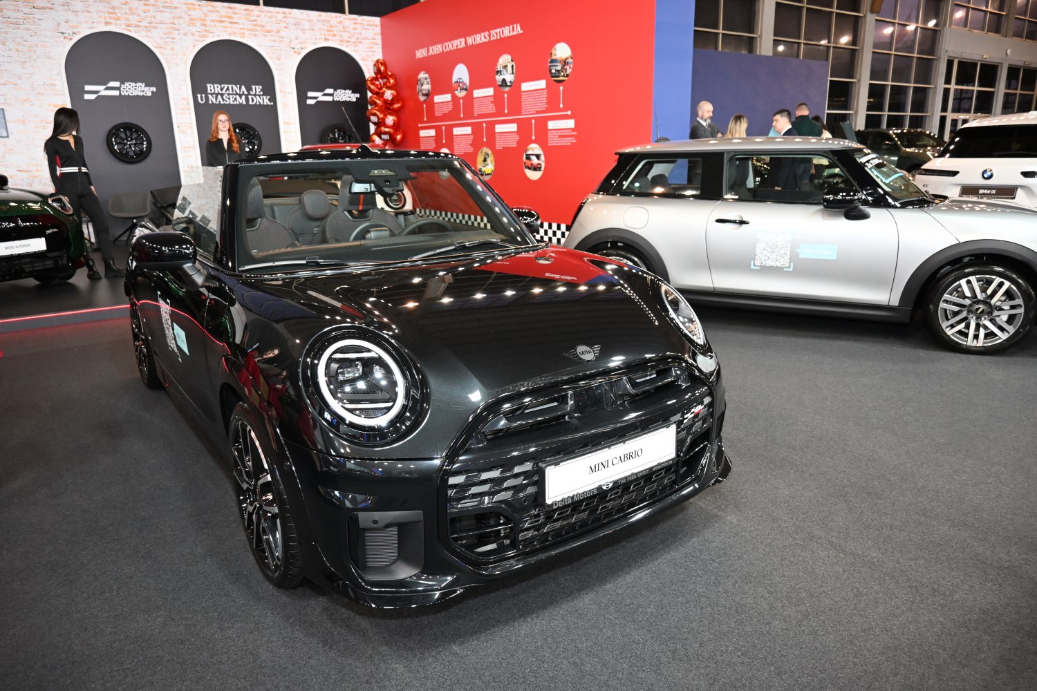 Front view of black convertible with round LED headlights