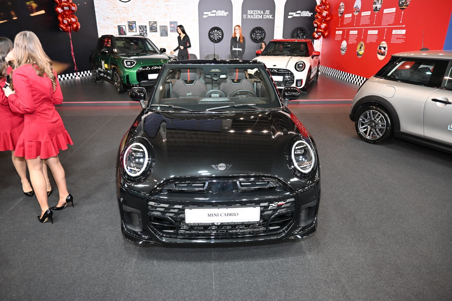 Front view with round LED headlights and sporty grille
