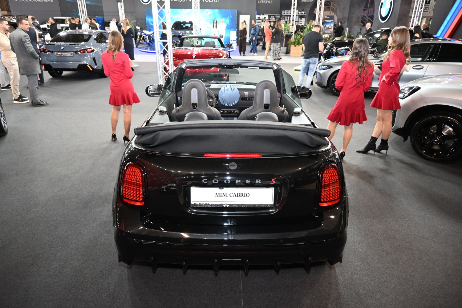 Rear view of convertible with open roof and modern taillights